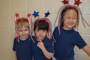 three kids with patriotic headbands